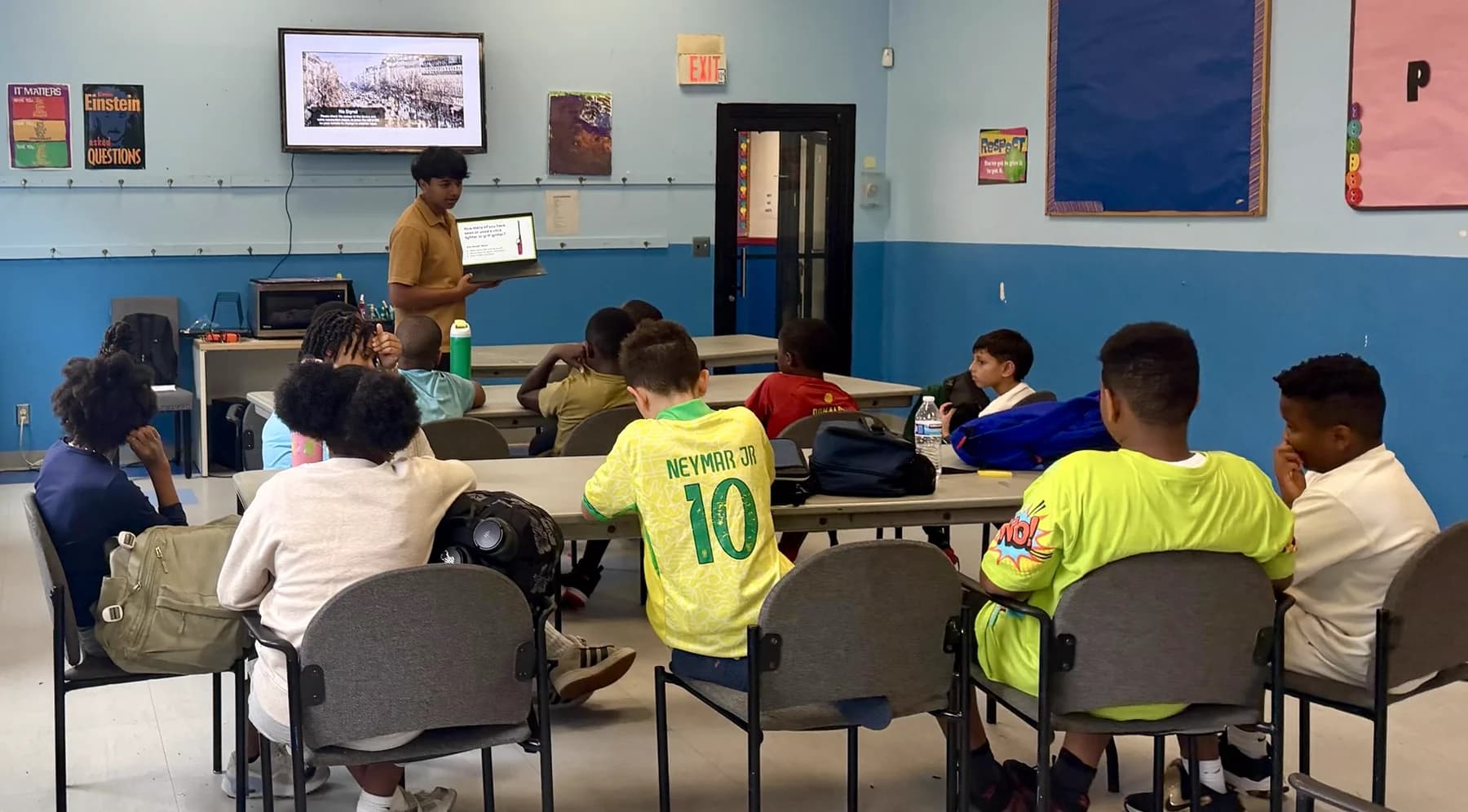 An Energize Youth instructor presenting a clean-energy lesson to students
